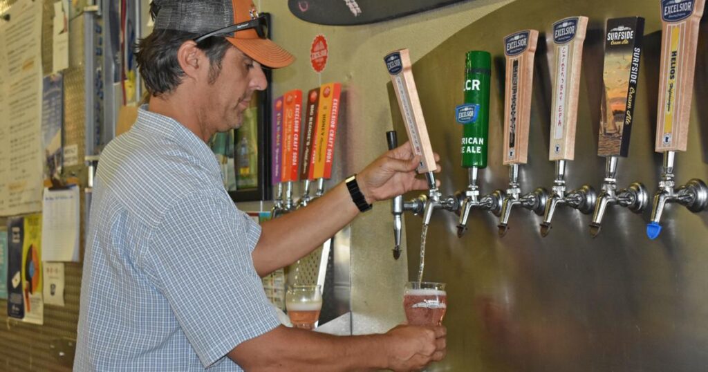 Pouring a beer at Excelsior Brewing