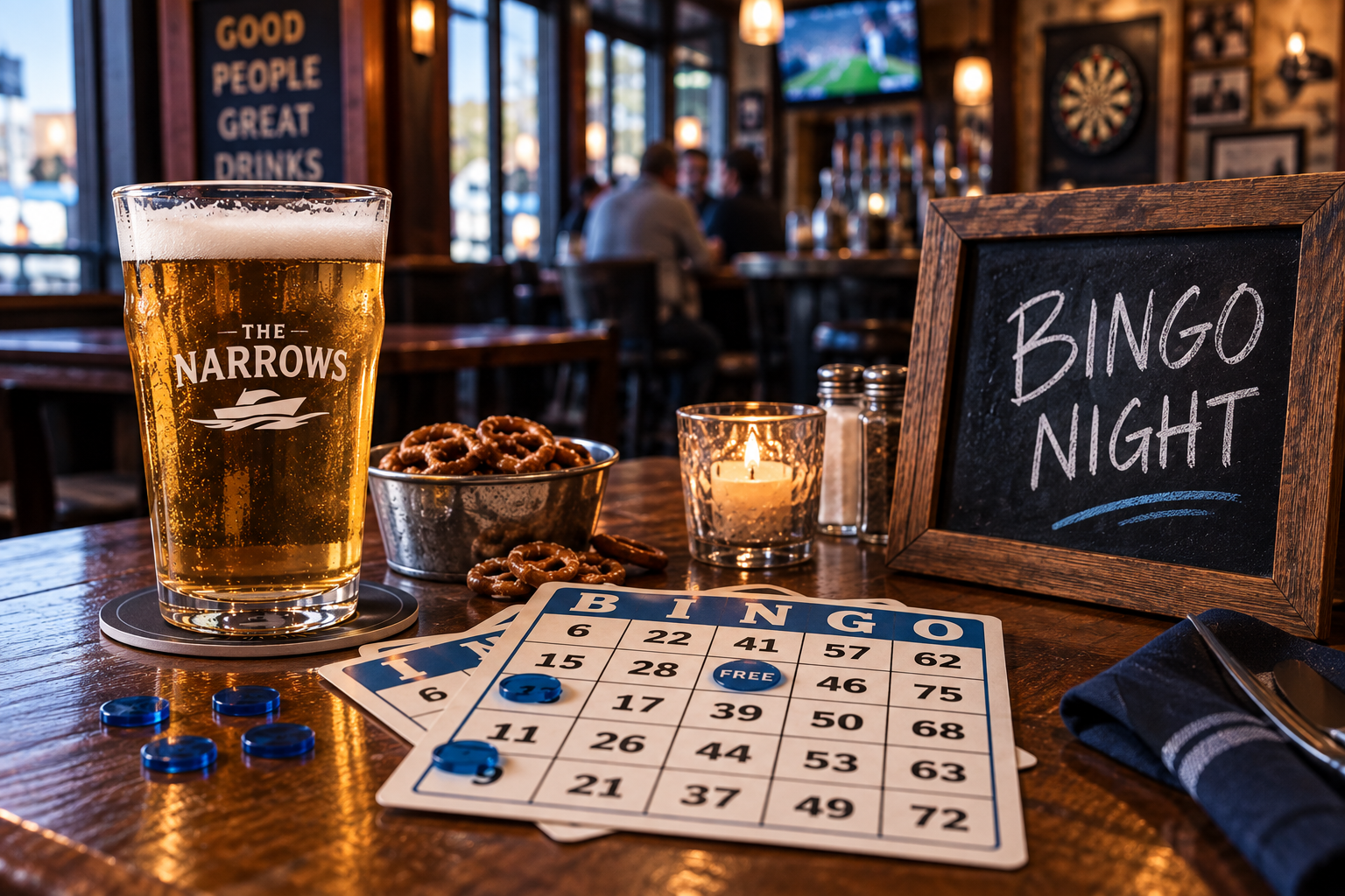 Bingo night at The Narrows Saloon with bingo cards, chips and a cold beer on a rustic table.